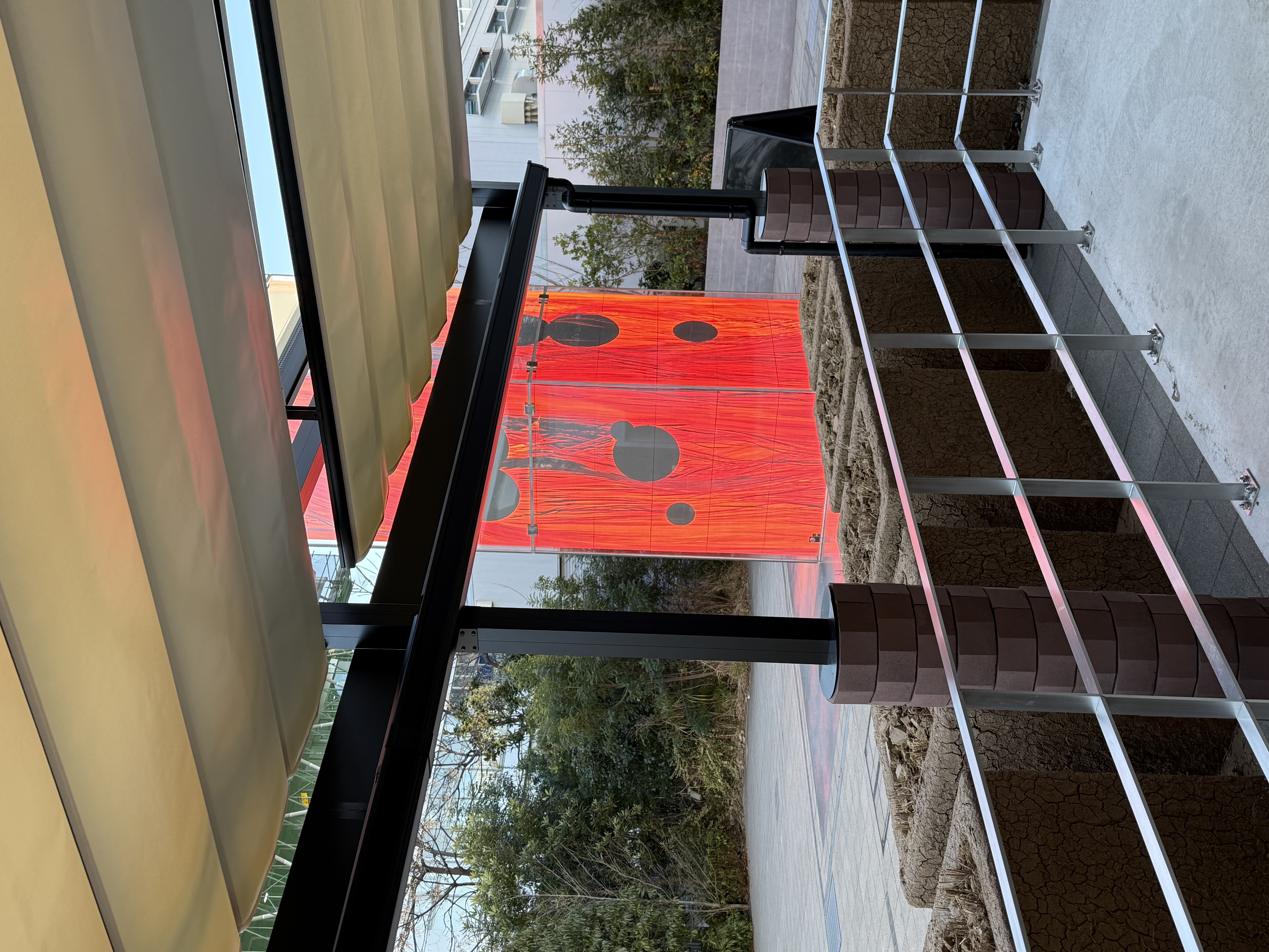 A large red obelisk with golf-ball to basketball-sized dots glows ominously, just outside the verdana
