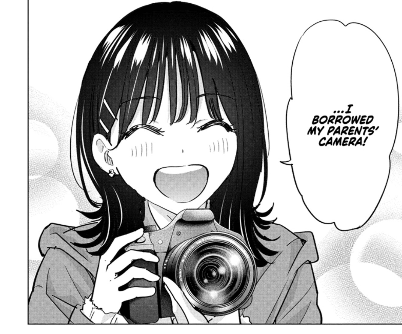 Honoka smiles while holding a camera, saying "...I borrowed my parents' camera!"