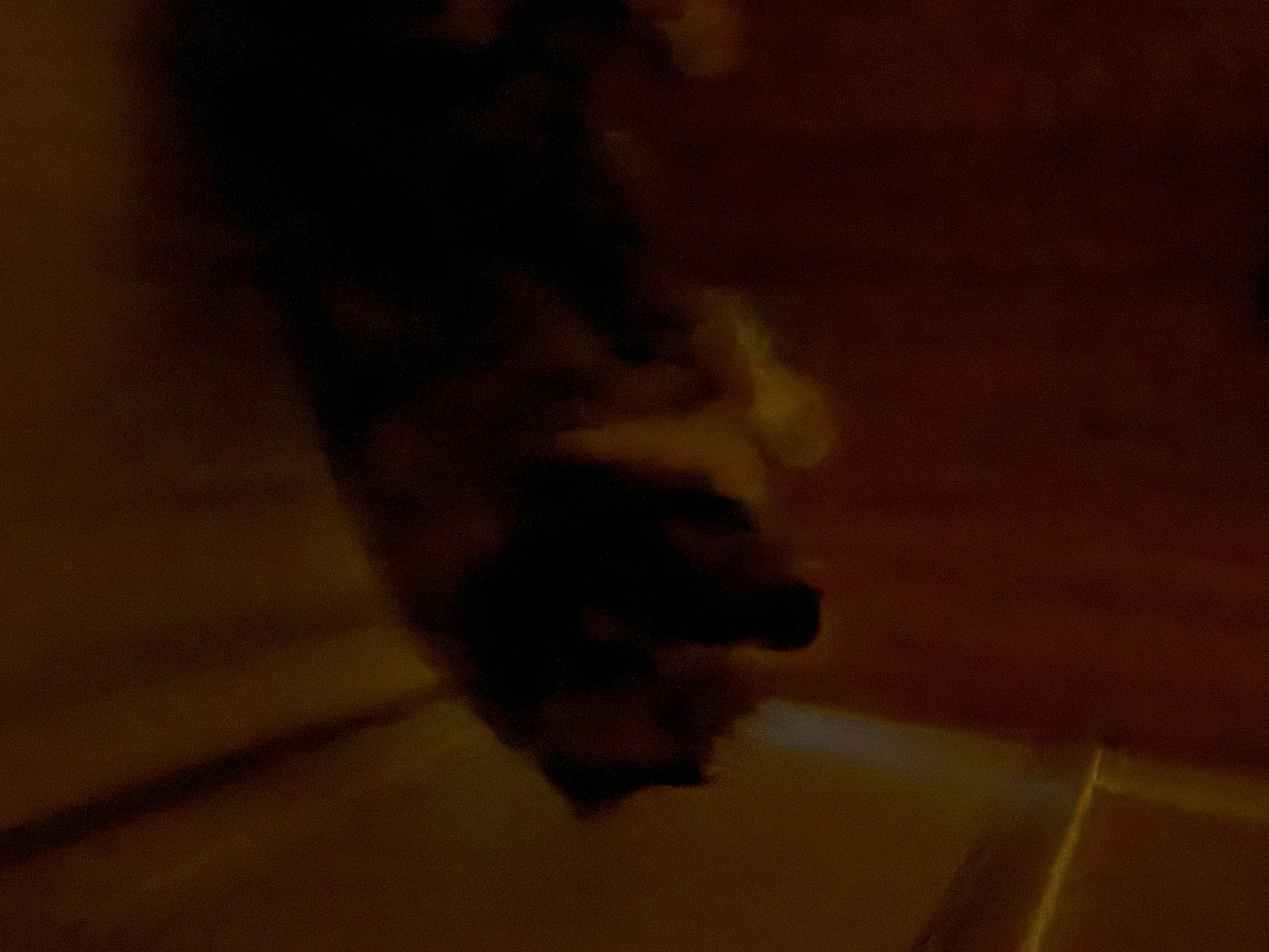 standing by the door, looking wistfully