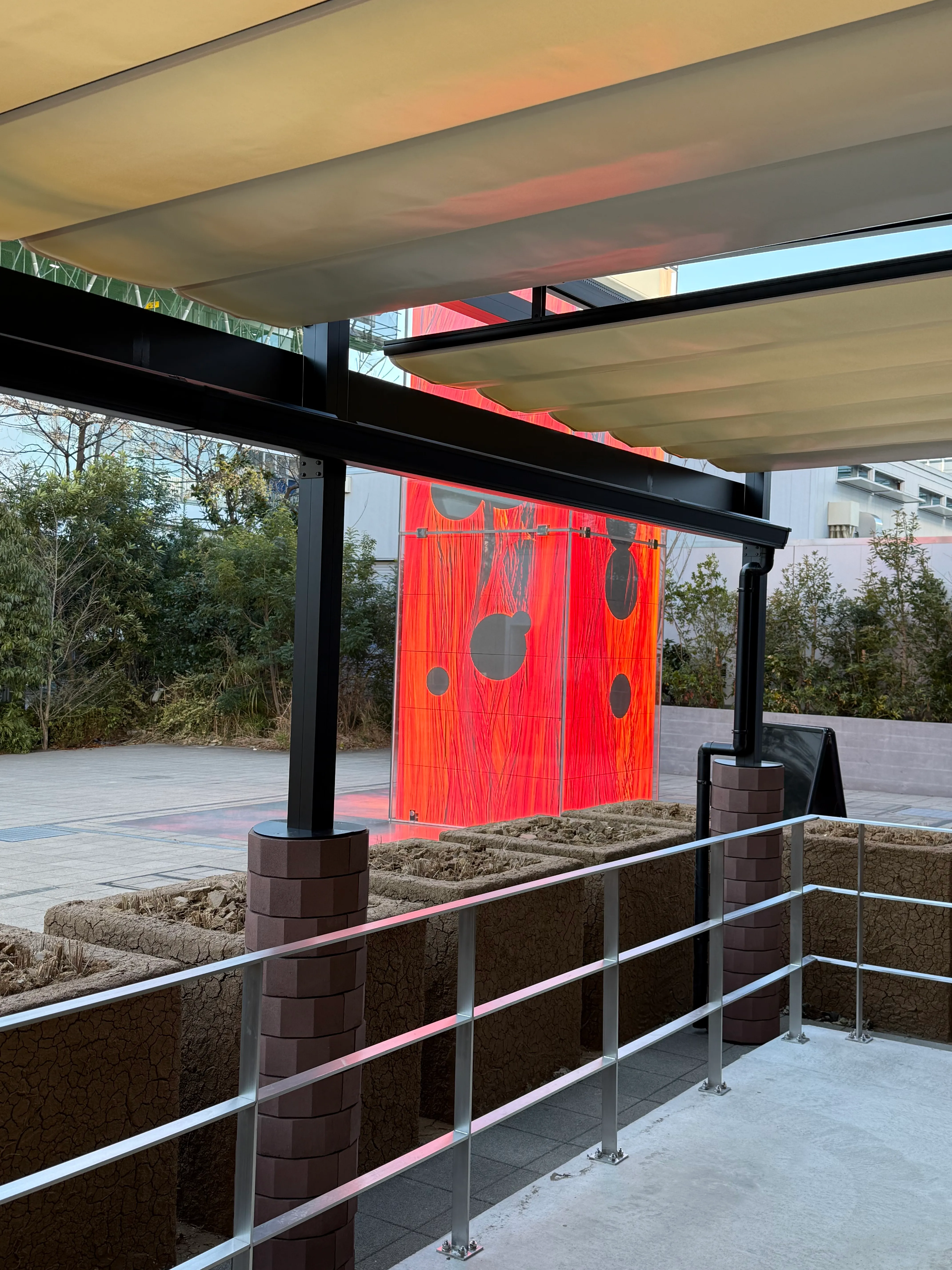 A large red obelisk with golf-ball to basketball-sized dots glows ominously, just outside the verdana